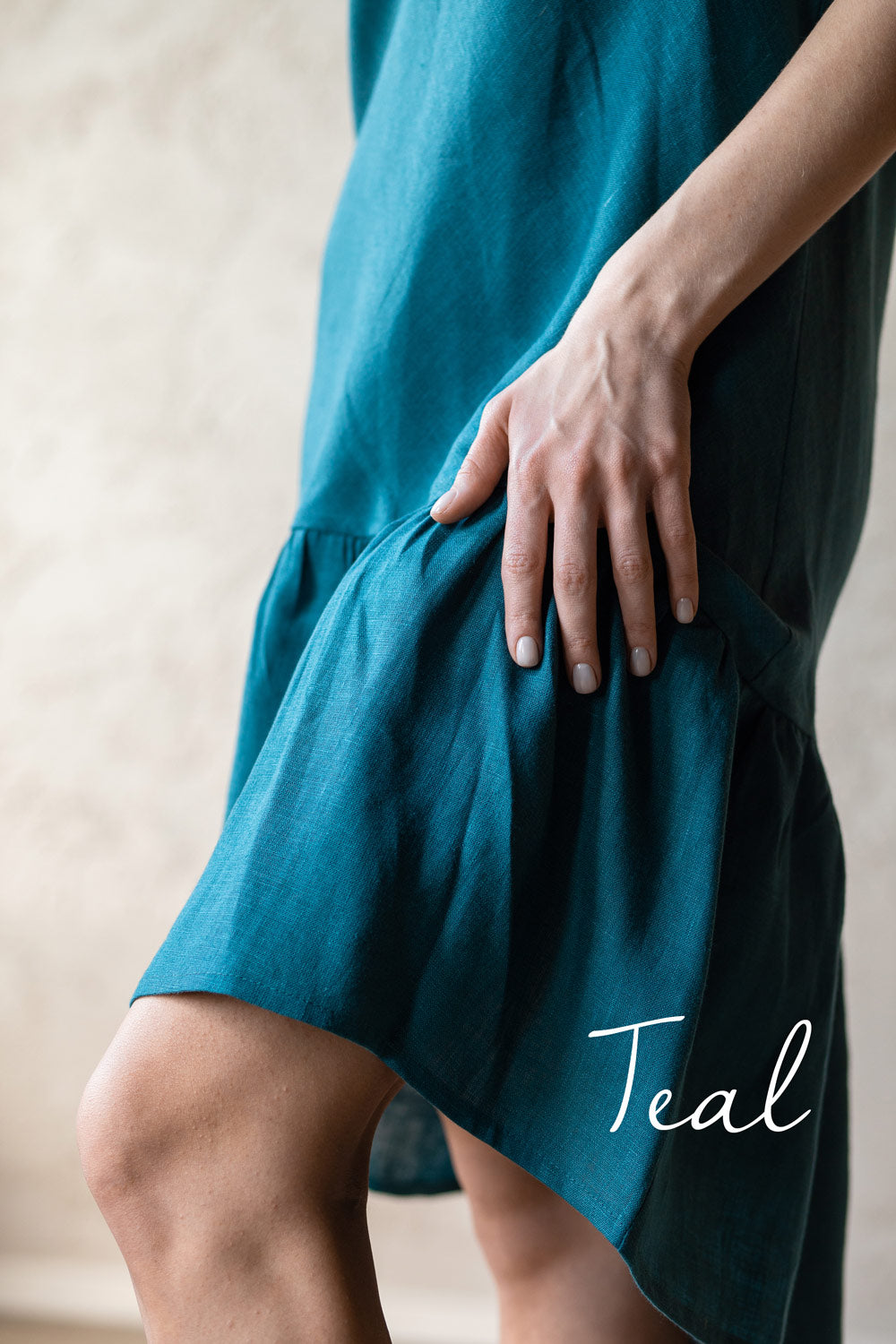 Teal pure linen dress with a neutral background