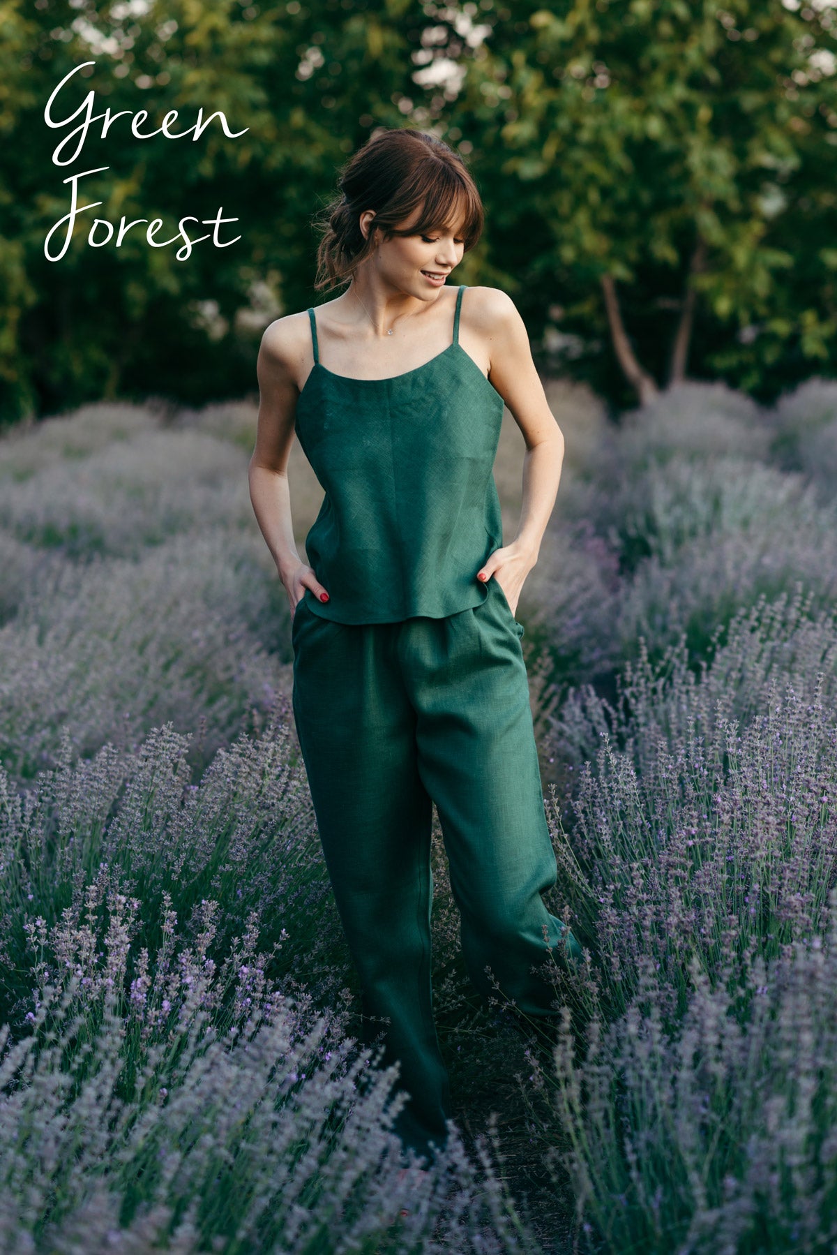Woman in a green pyjamas standing in a lavender field