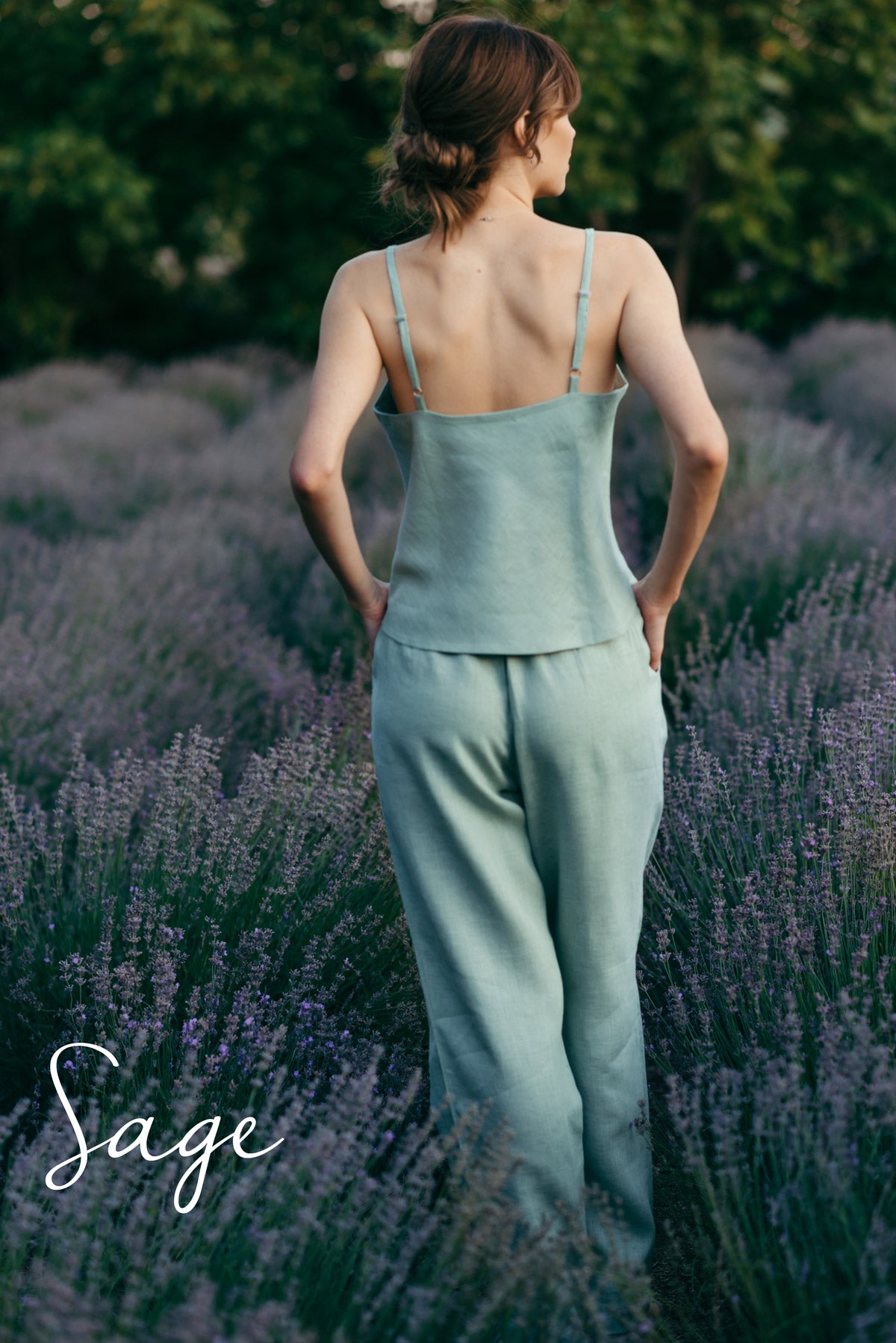 Woman in a light turquoise luxury pj set made from natural linen.
