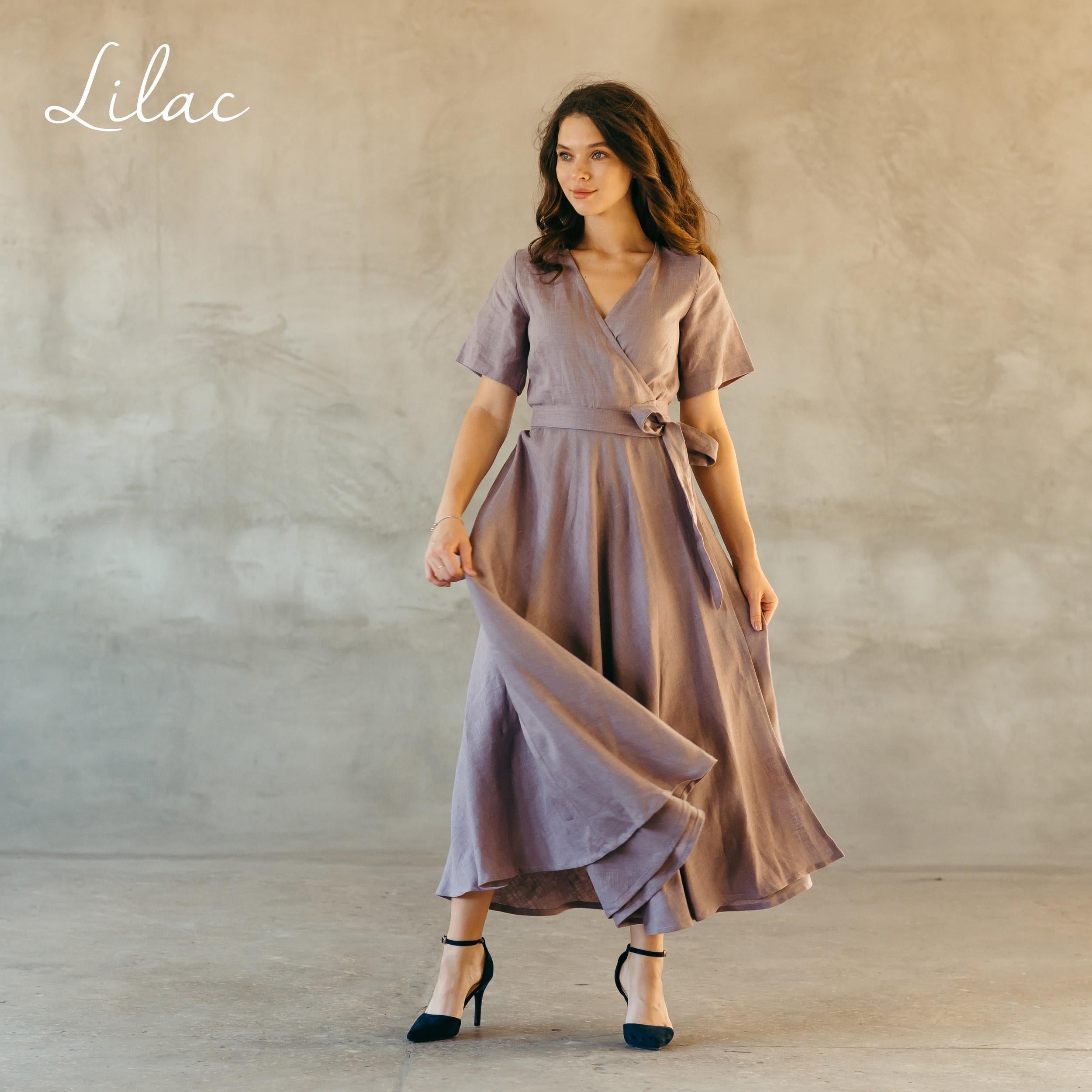 Woman wearing a lilac maxi linen dress against a neutral background