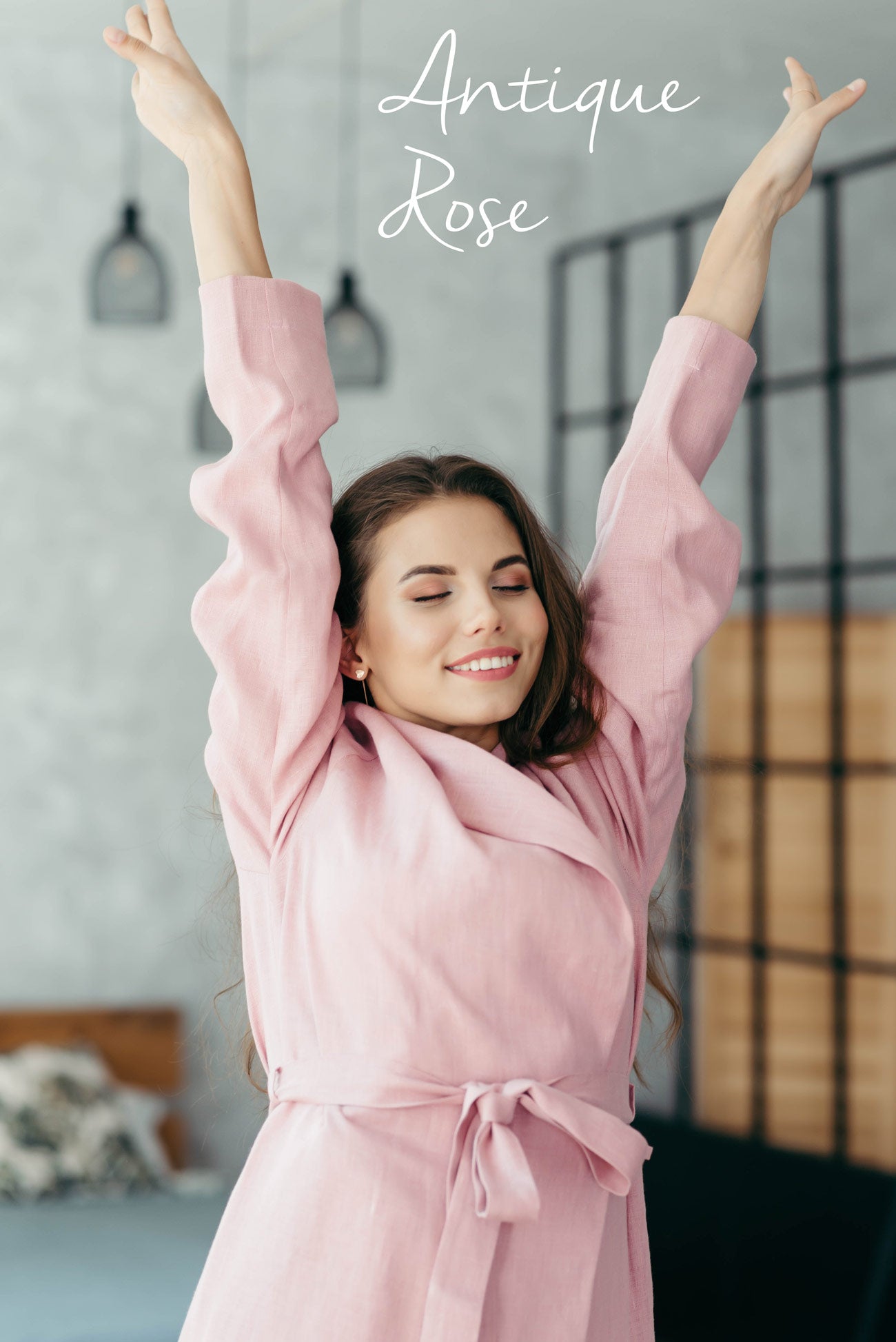 Woman wearing a pink women’s linen robe, relaxed sustainable dressing gown.