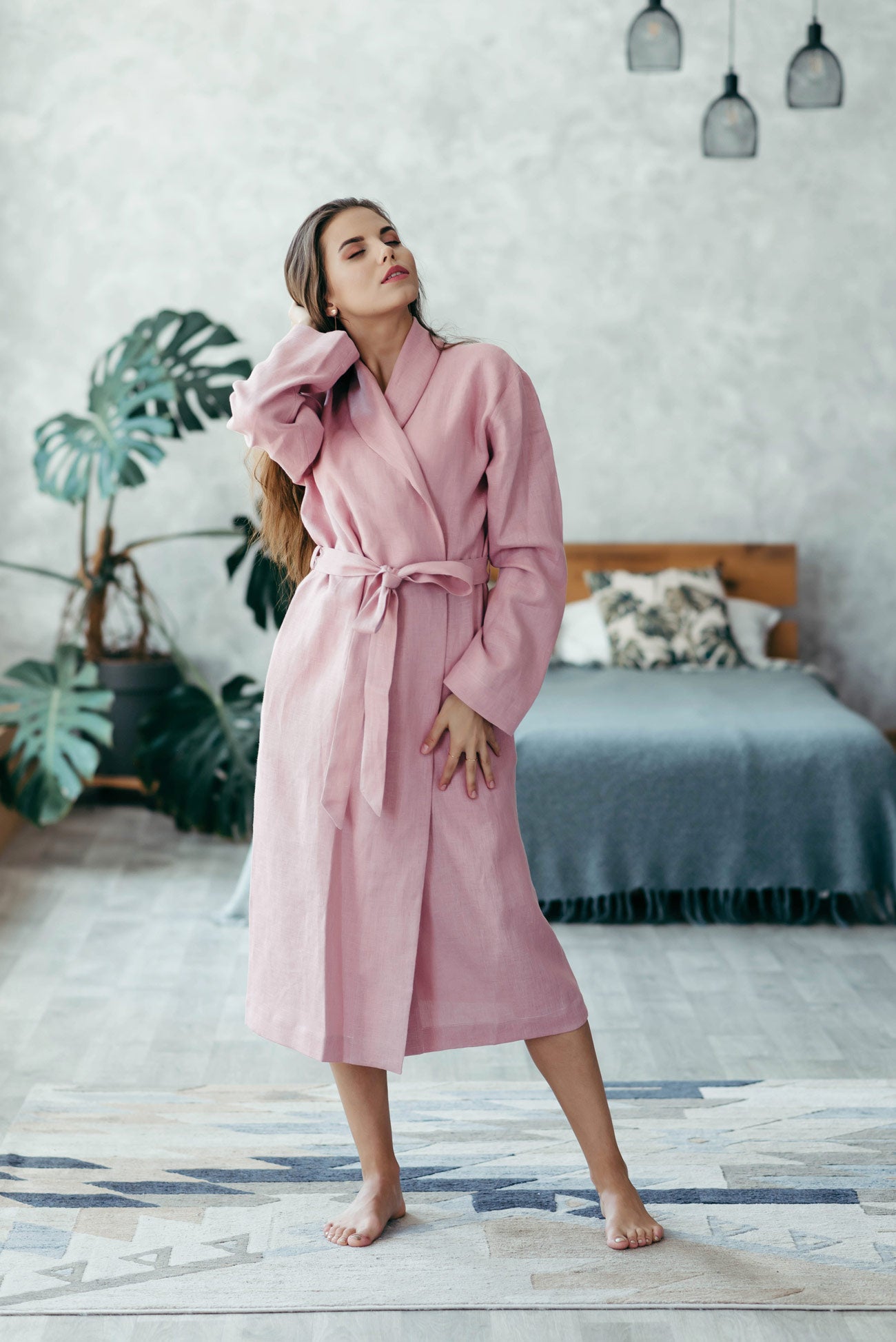 Woman posing in a antique rose linen bathrobe, soft European linen women’s robe.