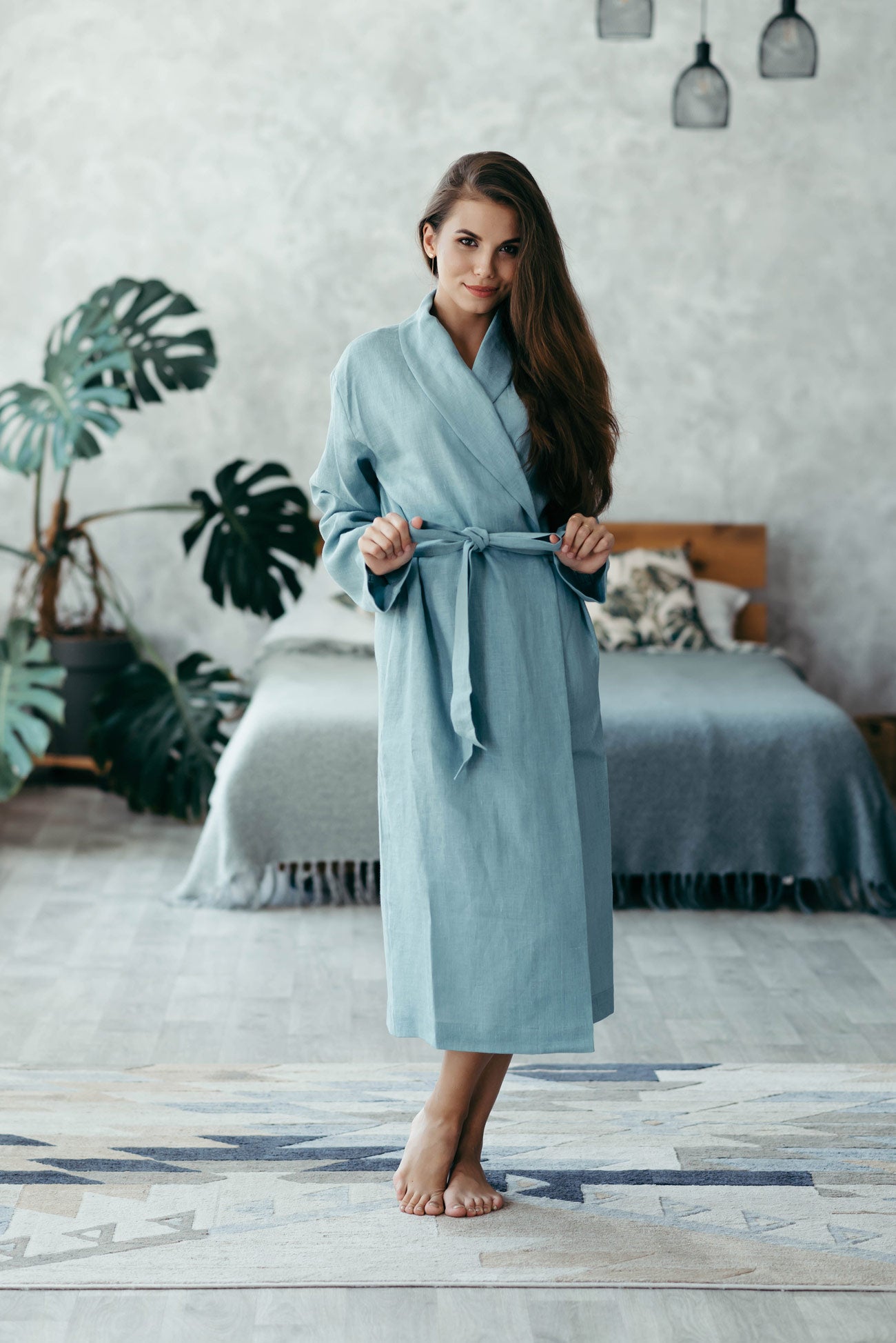 Woman wearing a luxurious spa robe gift she received on her wedding anniversary.