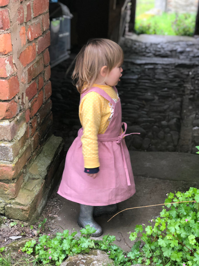 Customer wearing Girls’ Cross-Back Linen Apron