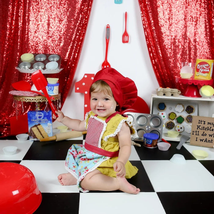 Customer wearing Kids' Personalised Aprons | Blue, Navy & Turquoise Prints