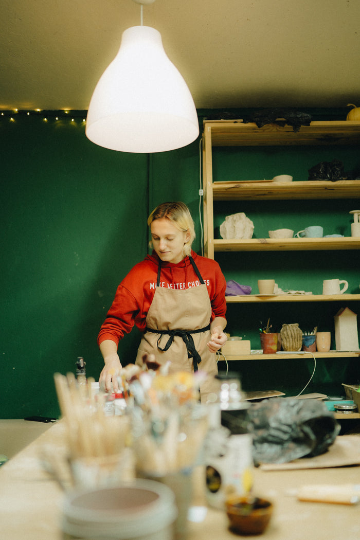 Customer wearing Durable Cotton Apron for Potters