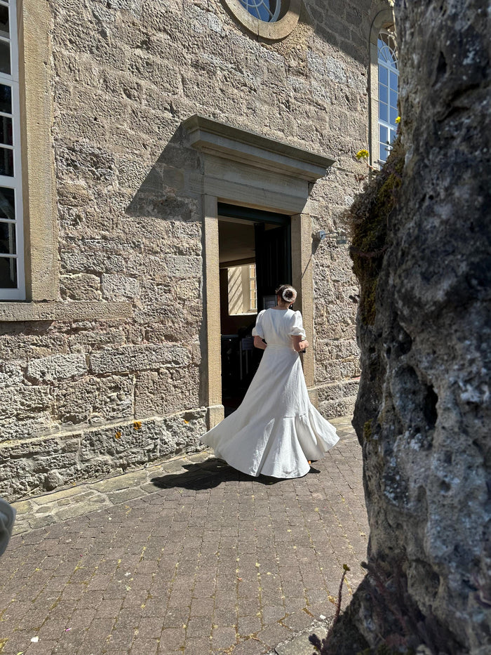 Customer wearing Boho Linen Wrap Wedding Dress | High-Low Skirt