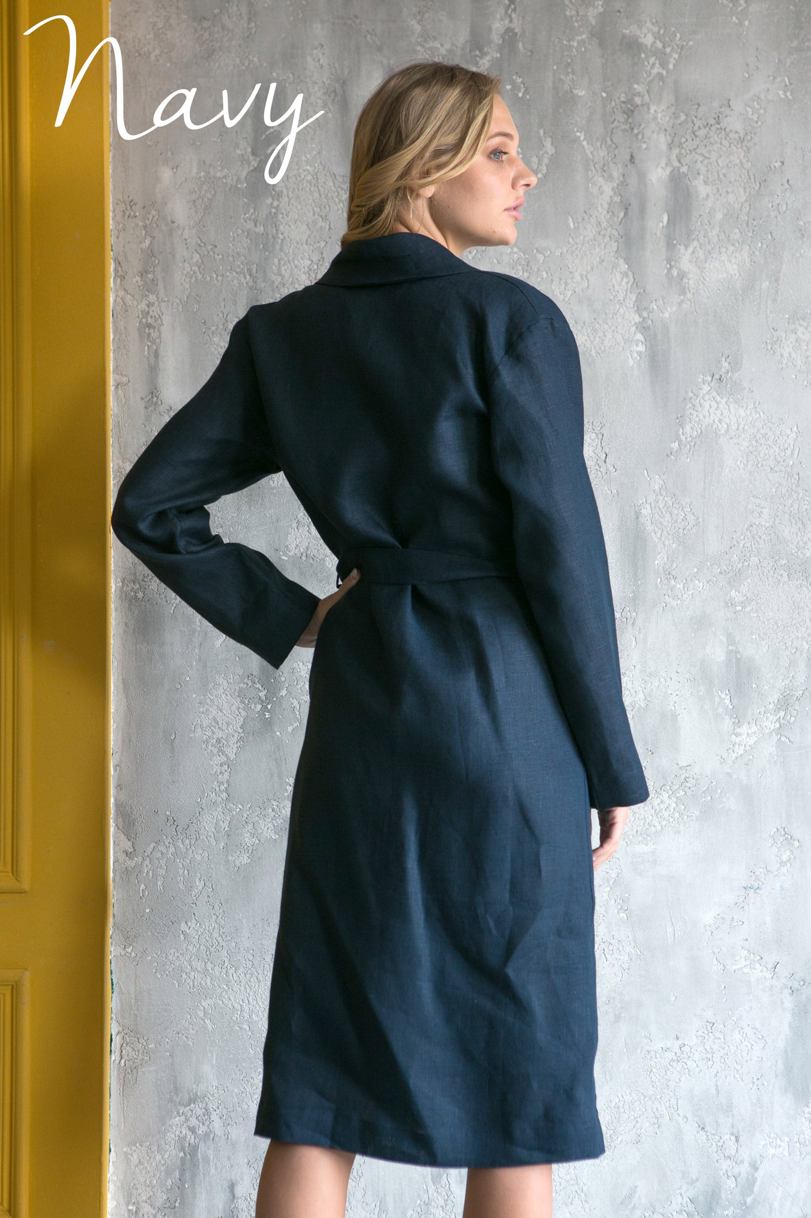 Woman wearing a navy linen robe, relaxed wrap bathrobe for women.