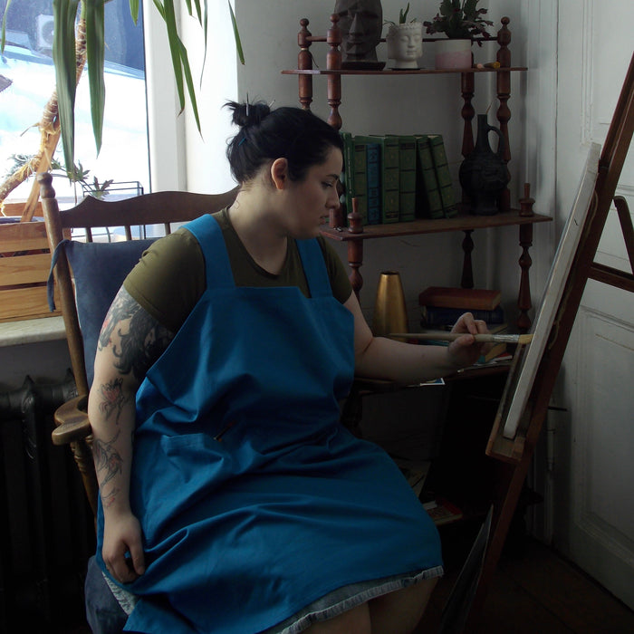 Customer wearing Durable Cotton Canvas Pinafore Apron | Cornflower Blue